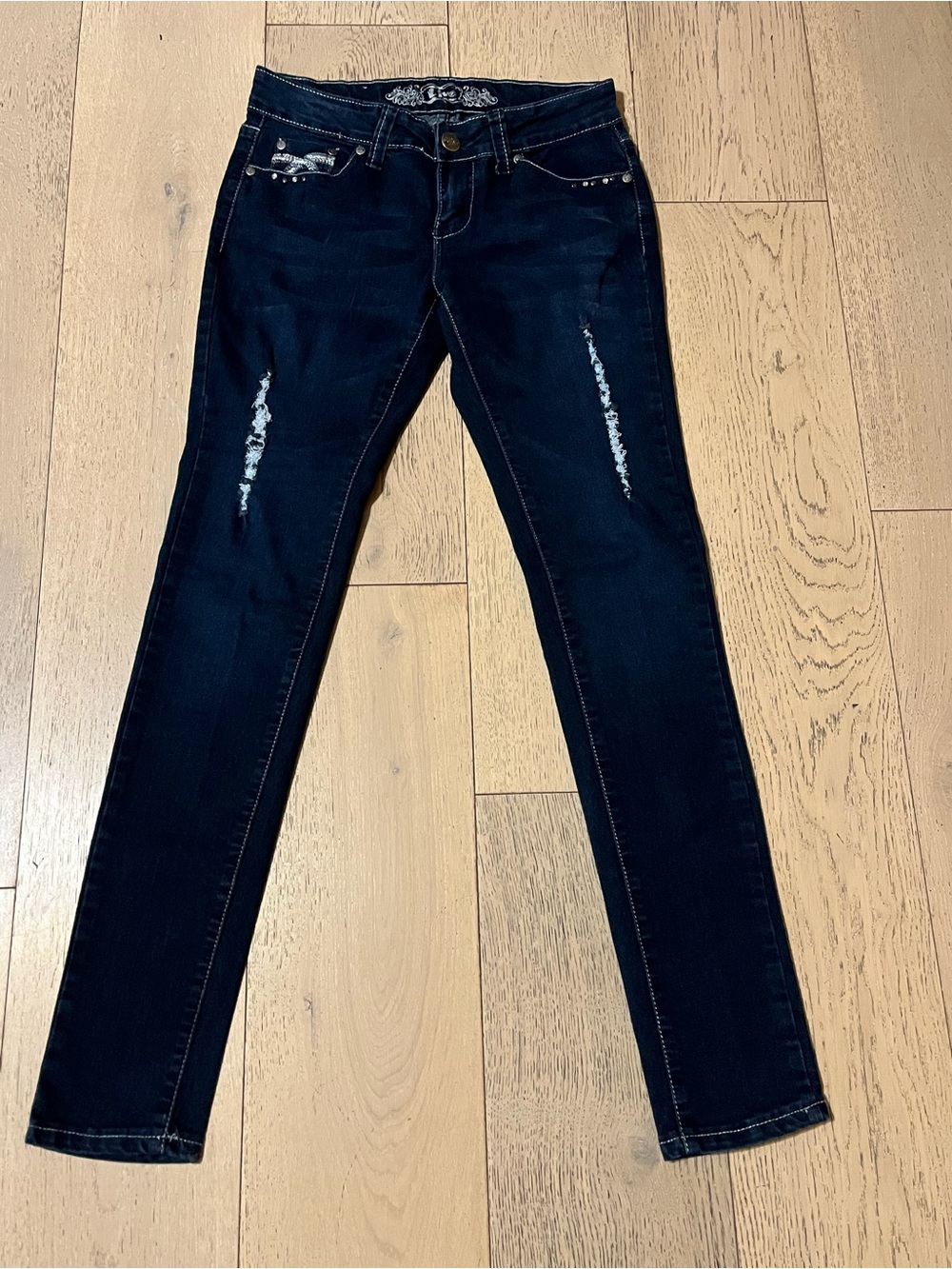 Dark Blue Skinny Jeans with Subtle Distress and Stud Details
